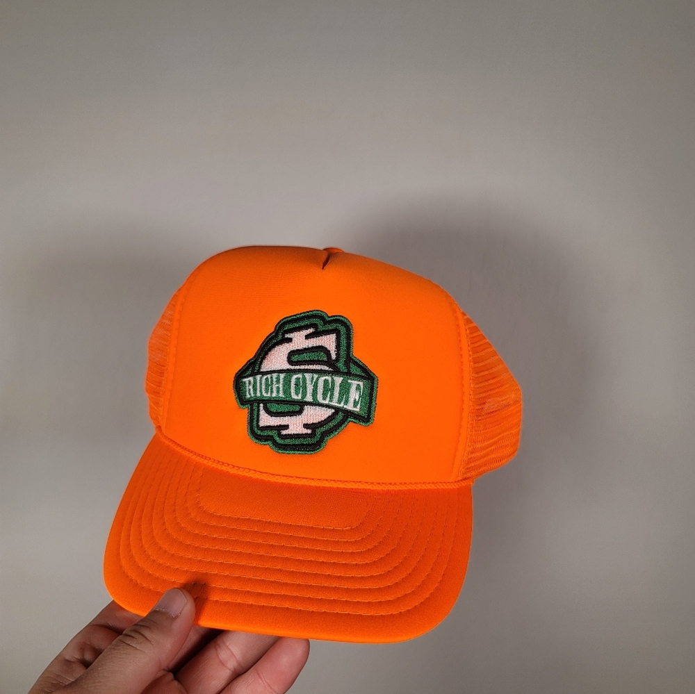 Rich Cycle Neon Orange Trucker Hat with Green Logo